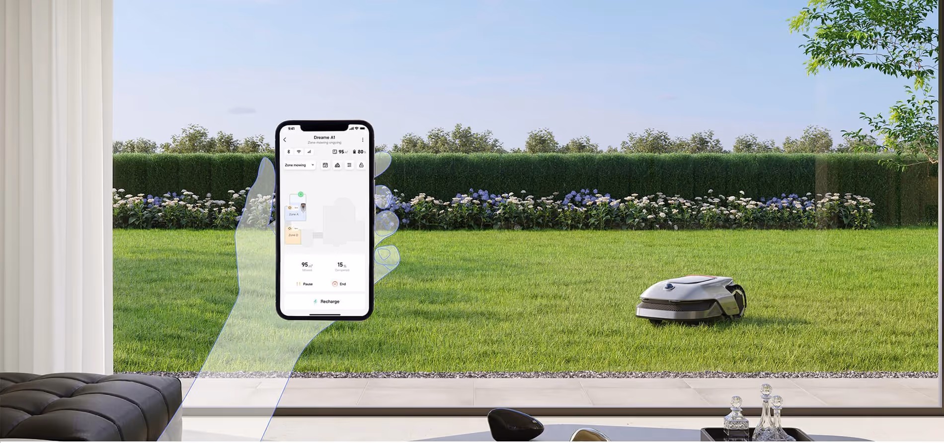 Robot koszący Dreame A1 na trawniku oraz ekran aplikacji mobilnej.